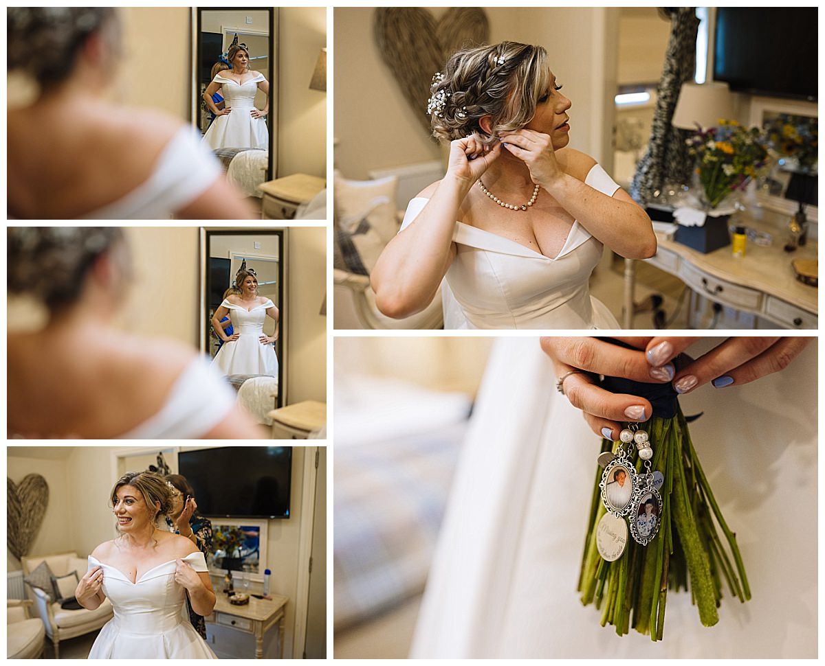 A bride getting ready, adjusting her earrings and dress while admiring herself in the mirror, holding a sentimental bouquet with photo charms.