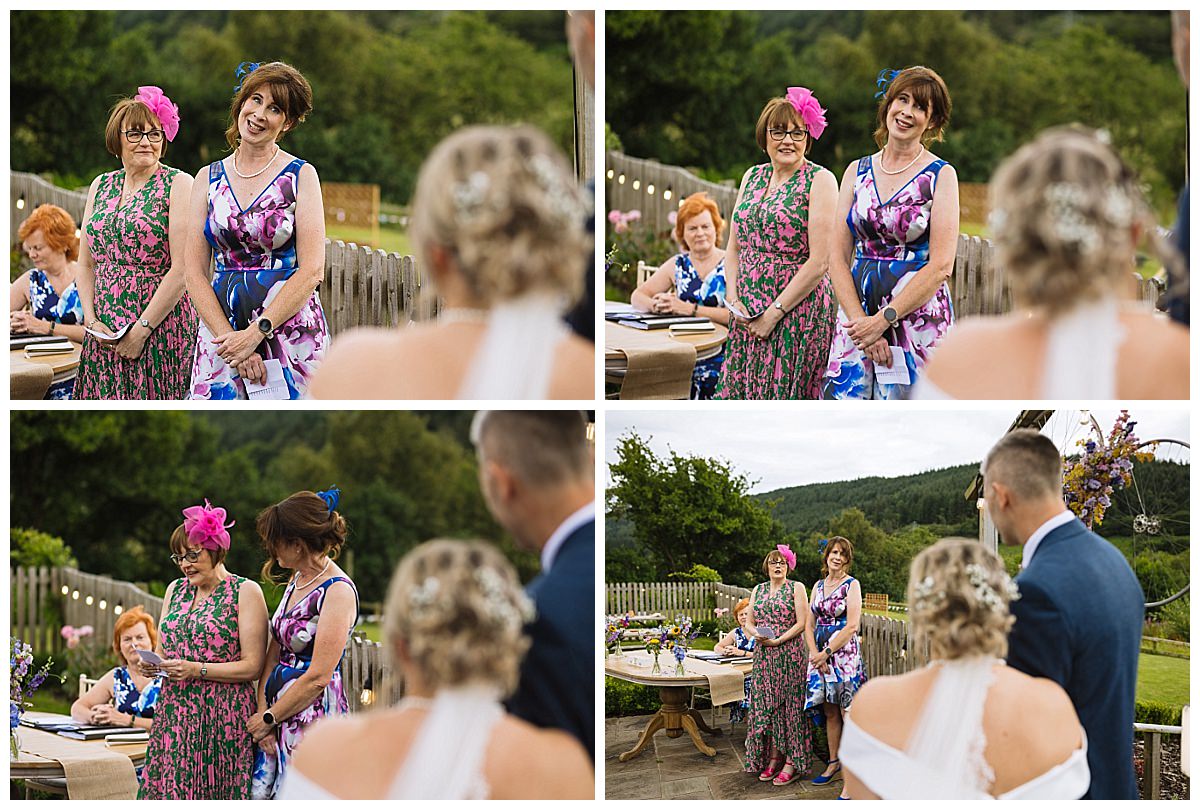 A group of women in colorful dresses delivering heartfelt speeches during a wedding ceremony at The Grousemoor, with guests attentively listening in a picturesque outdoor setting.