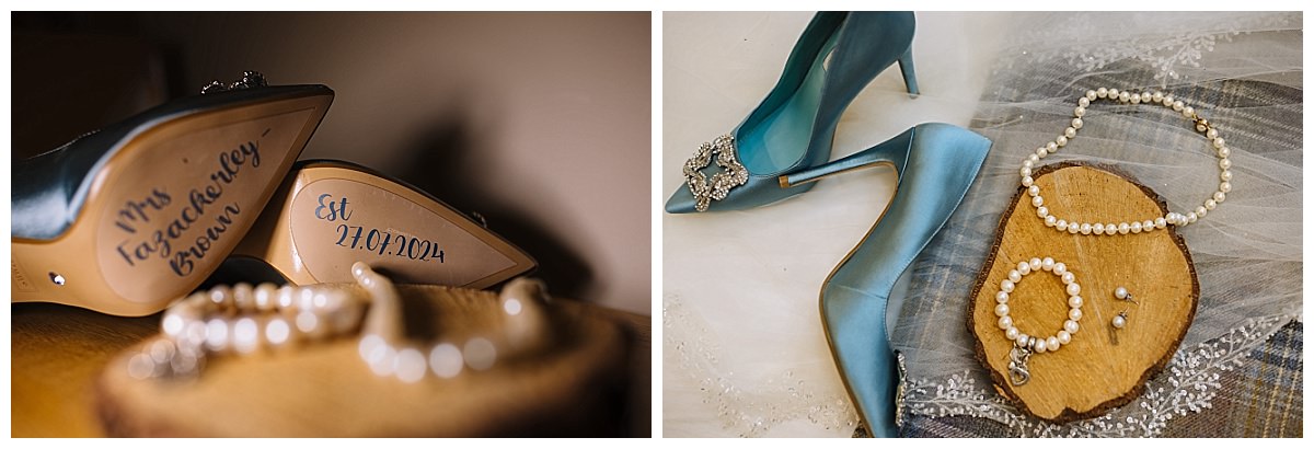 Close-up of personalized blue heels and pearl jewelry for a bride's special day, featuring engraved details and a rustic wooden display.
