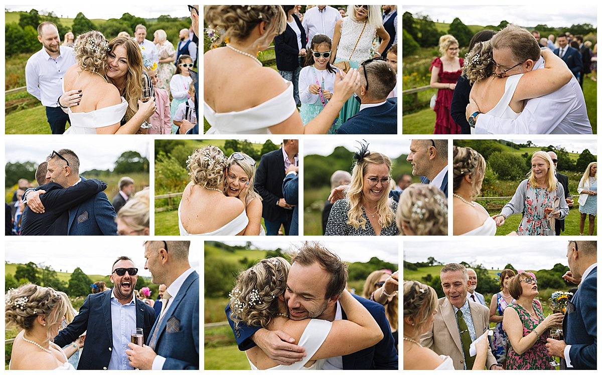 Guests sharing heartfelt embraces and joyful interactions in a picturesque outdoor setting during a wedding celebration.