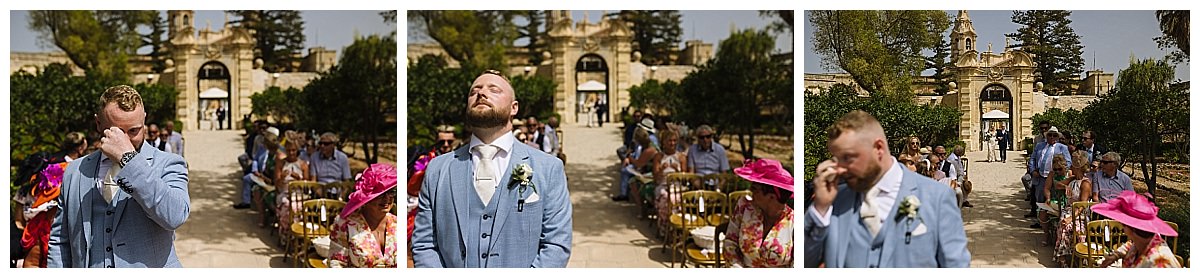 A groom visibly emotional as he anticipates the arrival of his bride during an outdoor wedding ceremony at Palazzo Parisio, surrounded by guests in a picturesque setting.